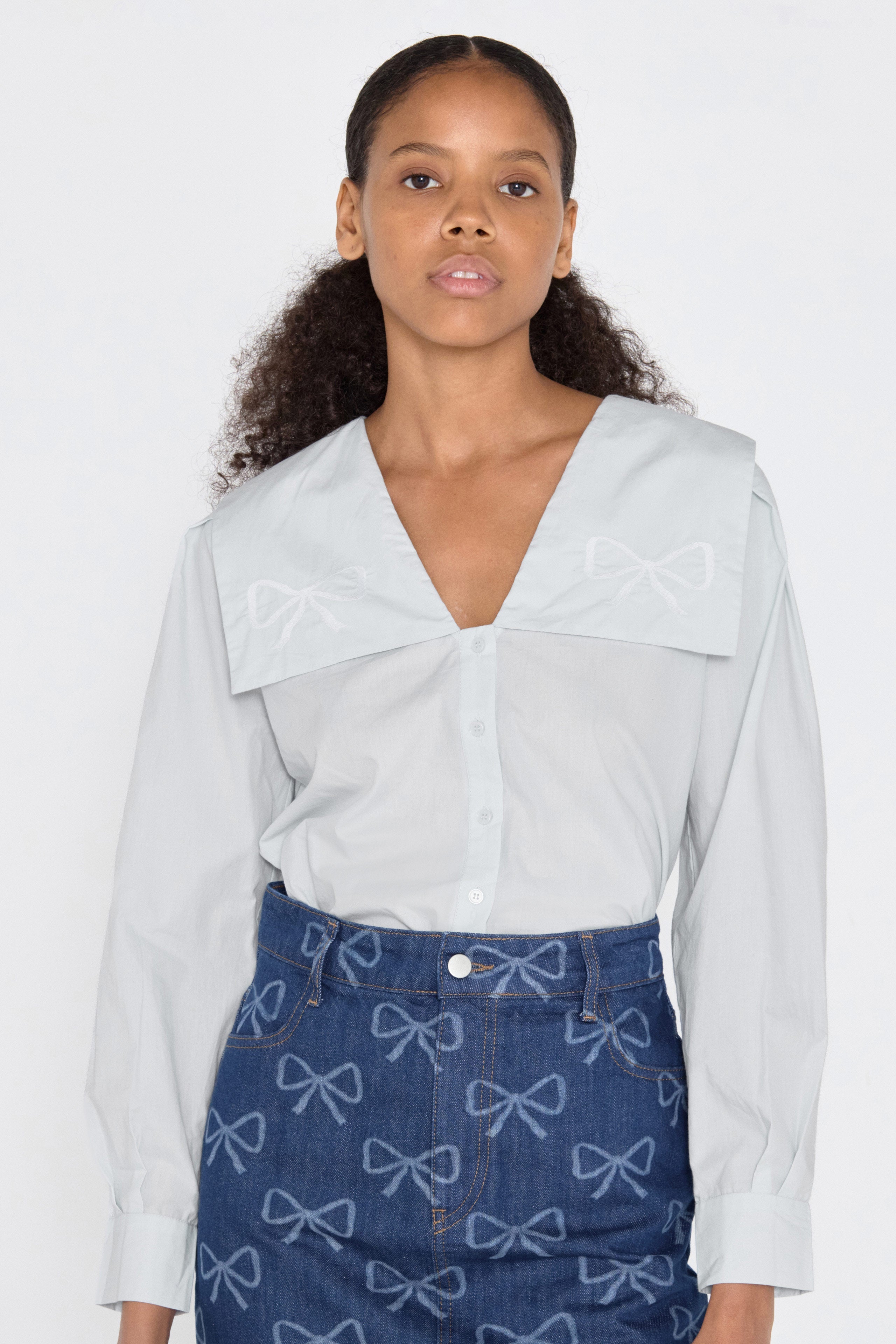 Bow embroidered blouse pastel blue